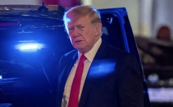 Donald Trump serious expression at night