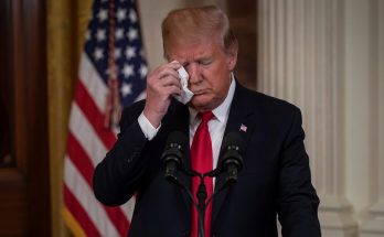 Trump wipes tears at podium