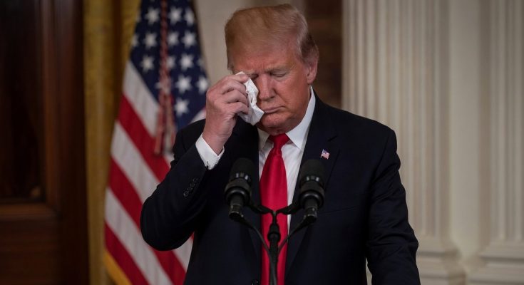 Trump wipes tears at podium